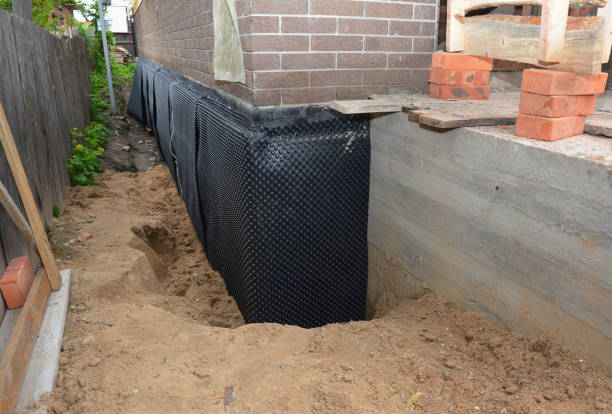 SJ Waterproofing Pros technician performing targeted Emergency Waterproofing assessment in Woodbury, NY